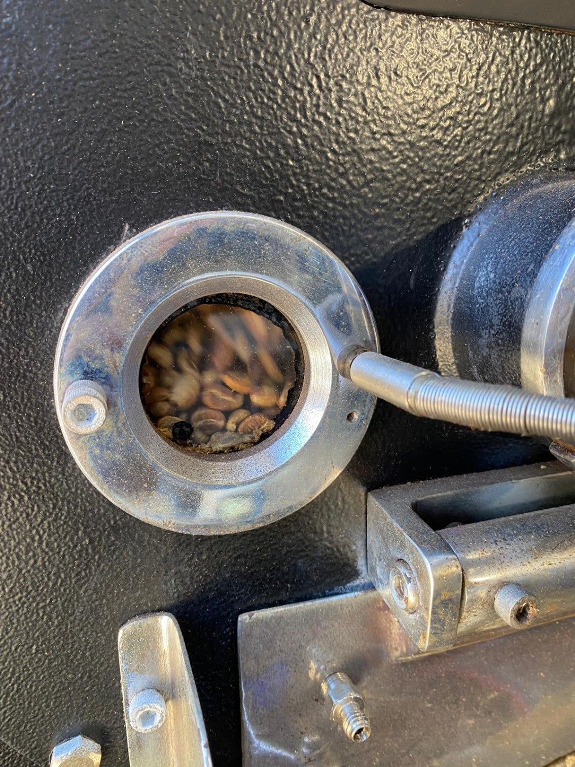 The initial stage of the roasting process for Andaky small-batch specialty coffee.